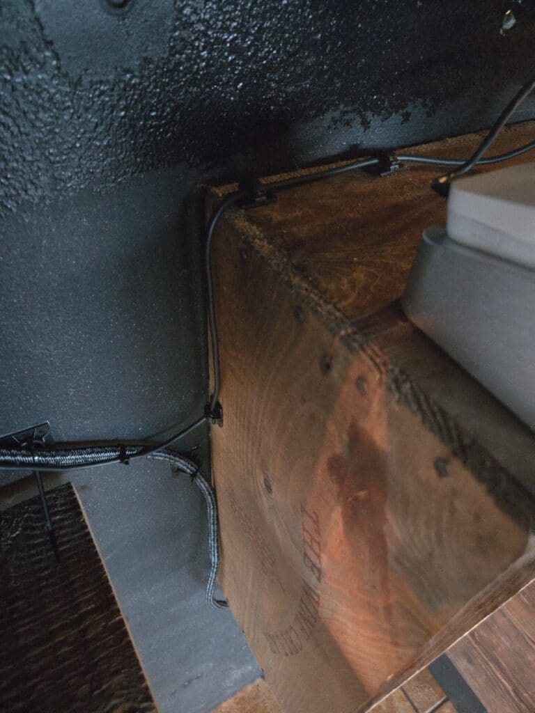 Clean and organized cable management behind kiosk installation