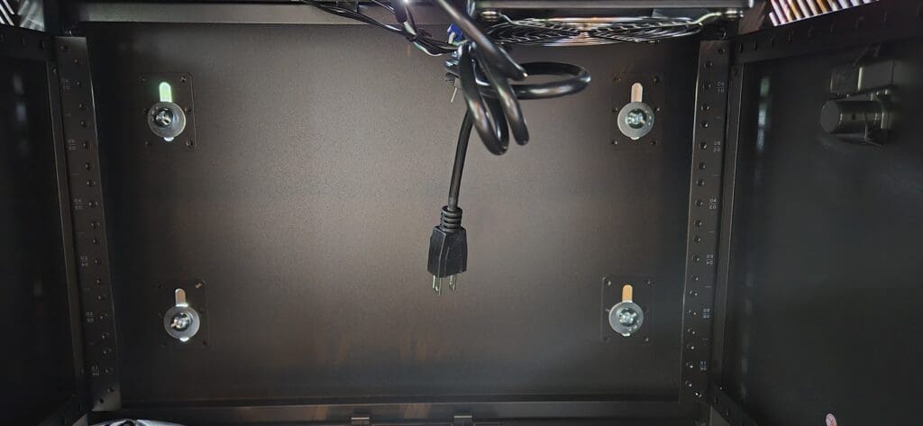 Screw anchor clamp detail securing the cabinet network to the wall